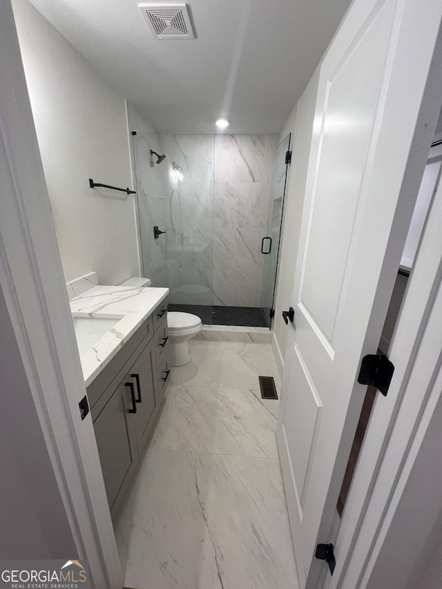 1227 Kenilworth Dr SW, Atlanta, GA 30310 - bathroom with marble finish floors, a marble finish shower, vanity, toilet, and recessed lighting