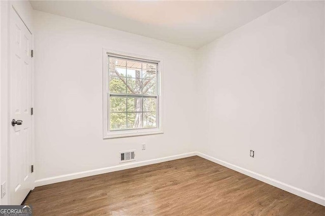4201 Regal Ridge Rd, Austell, GA 30106 - spare room featuring wood finished floors and baseboards