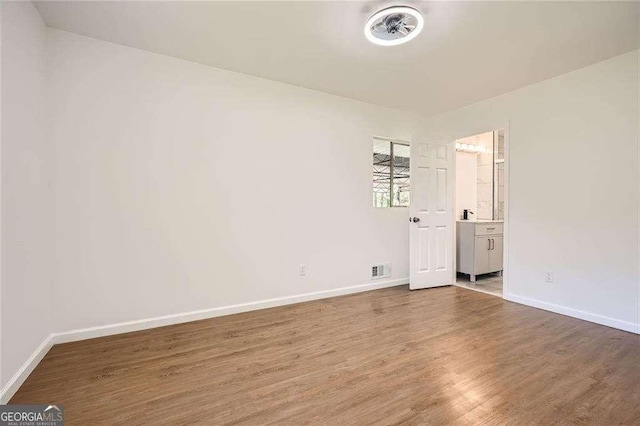 4201 Regal Ridge Rd, Austell, GA 30106 - empty room with wood finished floors and baseboards
