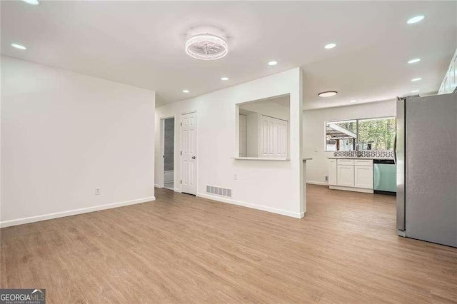 4201 Regal Ridge Rd, Austell, GA 30106 - unfurnished living room featuring light wood finished floors, recessed lighting, and baseboards