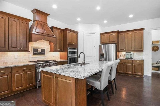 715 Creekside Bnd, Alpharetta, GA 30004 - kitchen featuring stainless steel appliances, a sink, a kitchen breakfast bar, a center island with sink, and custom range hood