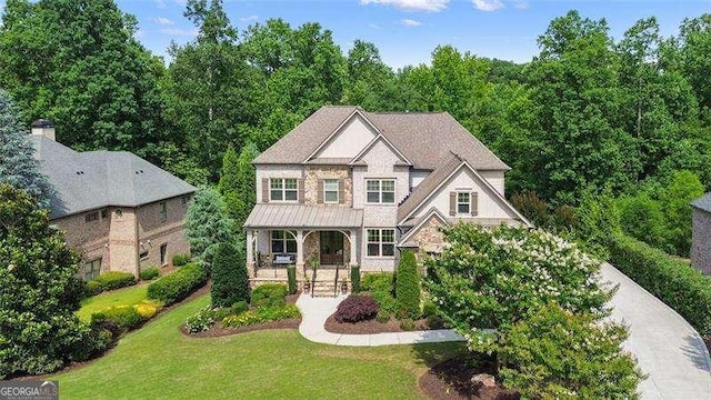 715 Creekside Bnd, Alpharetta, GA 30004 - view of front of home featuring a front lawn, a porch, stone siding, a standing seam roof, and metal roof