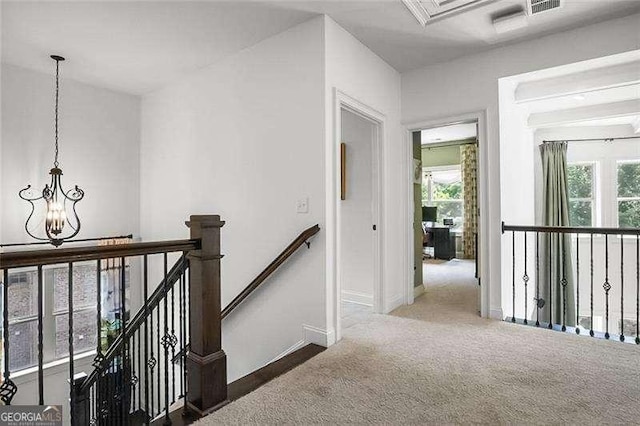 715 Creekside Bnd, Alpharetta, GA 30004 - hall with an upstairs landing, a chandelier, baseboards, and carpet