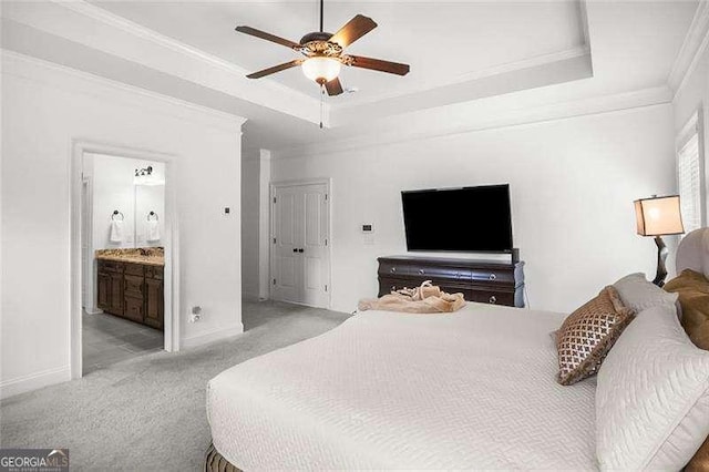 715 Creekside Bnd, Alpharetta, GA 30004 - bedroom with ornamental molding, a tray ceiling, light carpet, baseboards, and connected bathroom