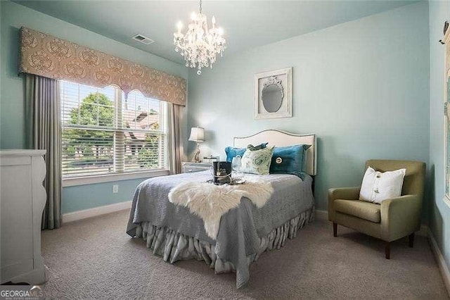 715 Creekside Bnd, Alpharetta, GA 30004 - bedroom with a chandelier, baseboards, and carpet floors