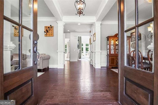 715 Creekside Bnd, Alpharetta, GA 30004 - entryway featuring decorative columns, crown molding, dark wood-style flooring, and baseboards
