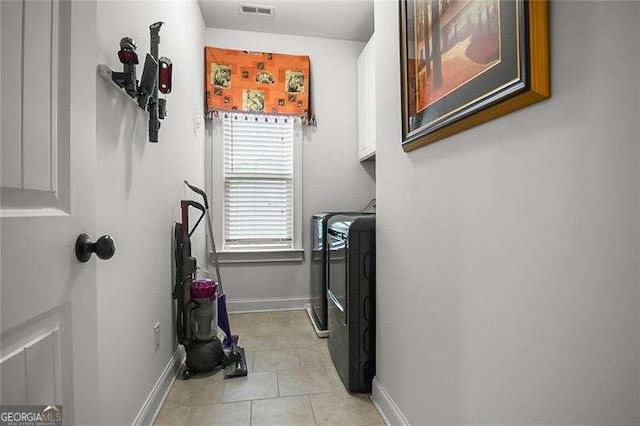 715 Creekside Bnd, Alpharetta, GA 30004 - laundry room with cabinet space, washing machine and clothes dryer, baseboards, and light tile patterned floors