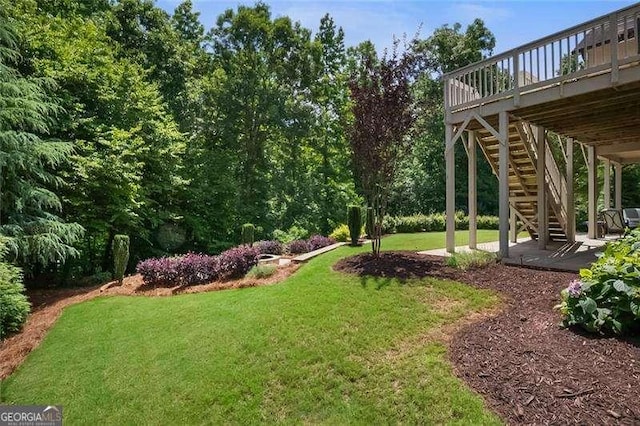 715 Creekside Bnd, Alpharetta, GA 30004 - view of grassy yard featuring stairway, a wooden deck, and a patio