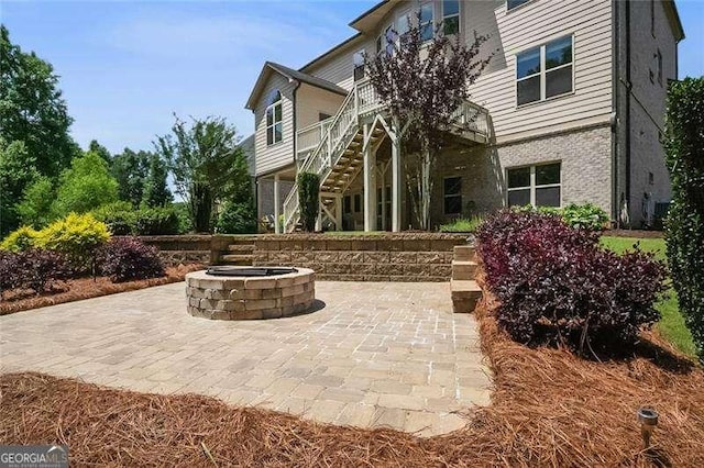 715 Creekside Bnd, Alpharetta, GA 30004 - view of patio / terrace featuring stairway and a fire pit