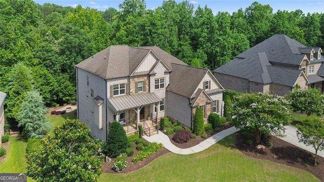 715 Creekside Bnd, Alpharetta, GA 30004 - view of front facade featuring a standing seam roof, metal roof, a front yard, and a forest view
