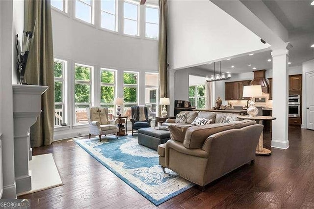 715 Creekside Bnd, Alpharetta, GA 30004 - living area with ornate columns, dark wood-style floors, a high ceiling, and recessed lighting