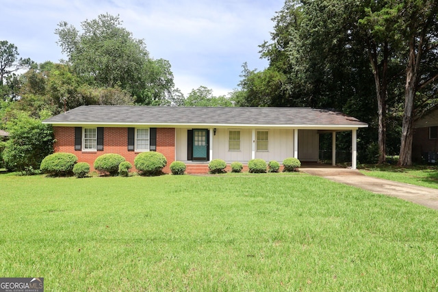 531 Ansley Ave, Perry, GA 31069 - ranch-style house with a front yard, concrete driveway, an attached carport, and brick siding