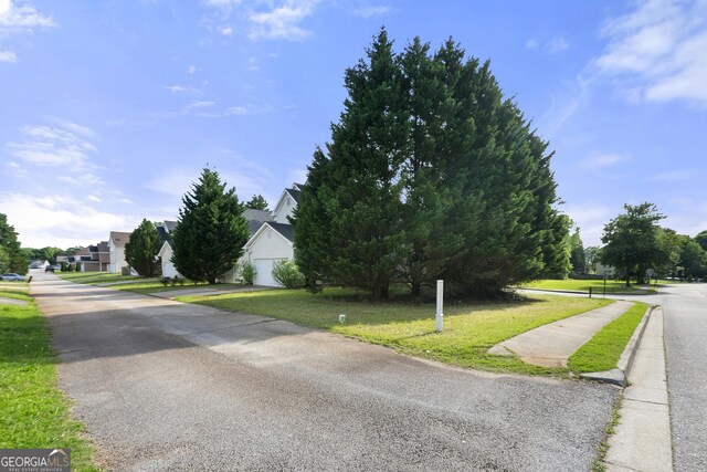 1995 Liberty Hts, Fairburn, GA 30213 - view of asphalt street featuring sidewalks and a residential view