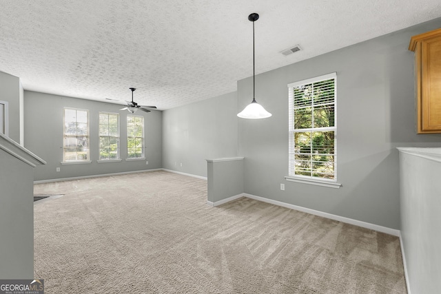 1995 Liberty Hts, Fairburn, GA 30213 - unfurnished dining area featuring a textured ceiling, a ceiling fan, light carpet, and baseboards