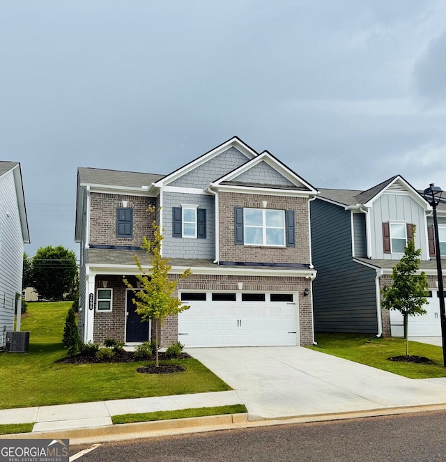 2690 Ravencliff Dr, Austell, GA 30168 - view of front of property featuring a garage, driveway, a front lawn, and brick siding