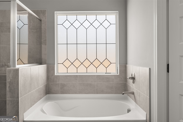 2690 Ravencliff Dr, Austell, GA 30168 - bathroom with a bath and a tile shower