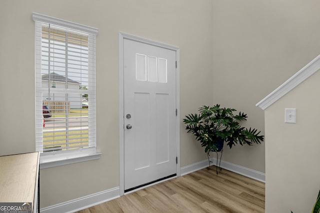 935 Abode Ave, Fort Stewart, GA 31313 - entrance foyer featuring wood finished floors, baseboards, and plenty of natural light