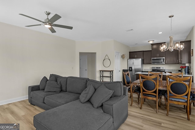 935 Abode Ave, Fort Stewart, GA 31313 - living area featuring a chandelier, light wood-type flooring, a ceiling fan, baseboards, and recessed lighting