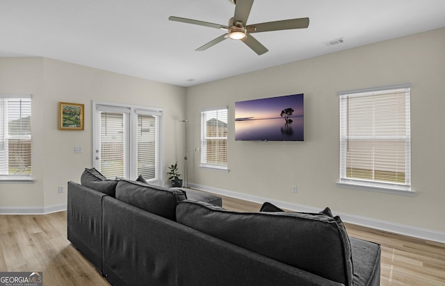 935 Abode Ave, Fort Stewart, GA 31313 - living area with light wood-style flooring, baseboards, and a ceiling fan