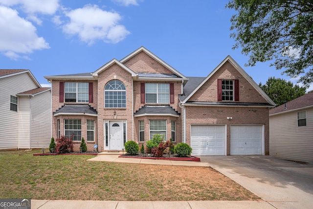 3740 Arminto Dr, Ellenwood, GA 30294 - traditional-style home with brick siding, concrete driveway, a front lawn, and a garage