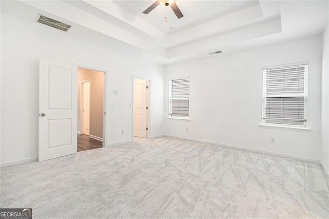 3514 Ambassador, Scottdale, GA 30079 - unfurnished bedroom with carpet flooring, a raised ceiling, and a ceiling fan