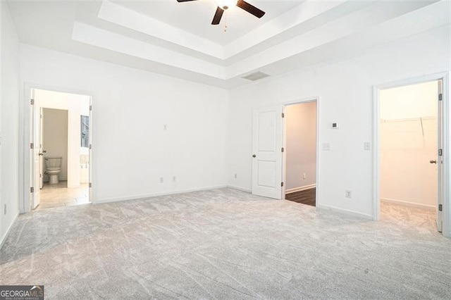 3514 Ambassador Aly, Scottdale, GA 30079 - unfurnished bedroom with carpet floors, a raised ceiling, a spacious closet, and baseboards