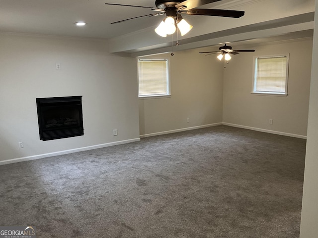 1776 Smokey Rd, Lagrange, GA 30241 - unfurnished living room featuring ornamental molding, a ceiling fan, dark carpet, baseboards, and a fireplace