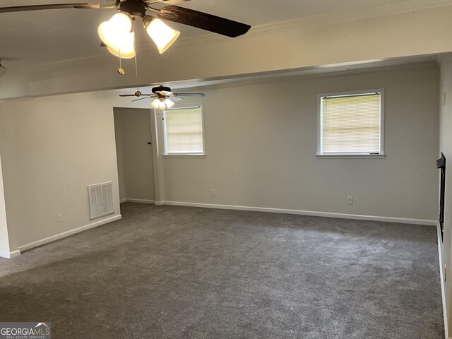 1776 Smokey Rd, Lagrange, GA 30241 - empty room with a ceiling fan, dark carpet, ornamental molding, and baseboards