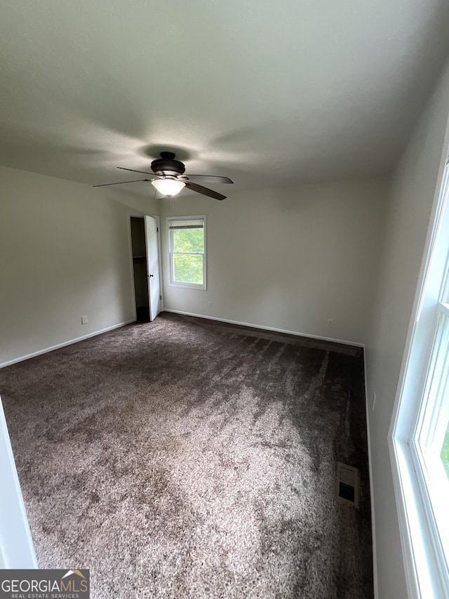 1776 Smokey Rd, Lagrange, GA 30241 - unfurnished room featuring dark colored carpet, ceiling fan, and baseboards