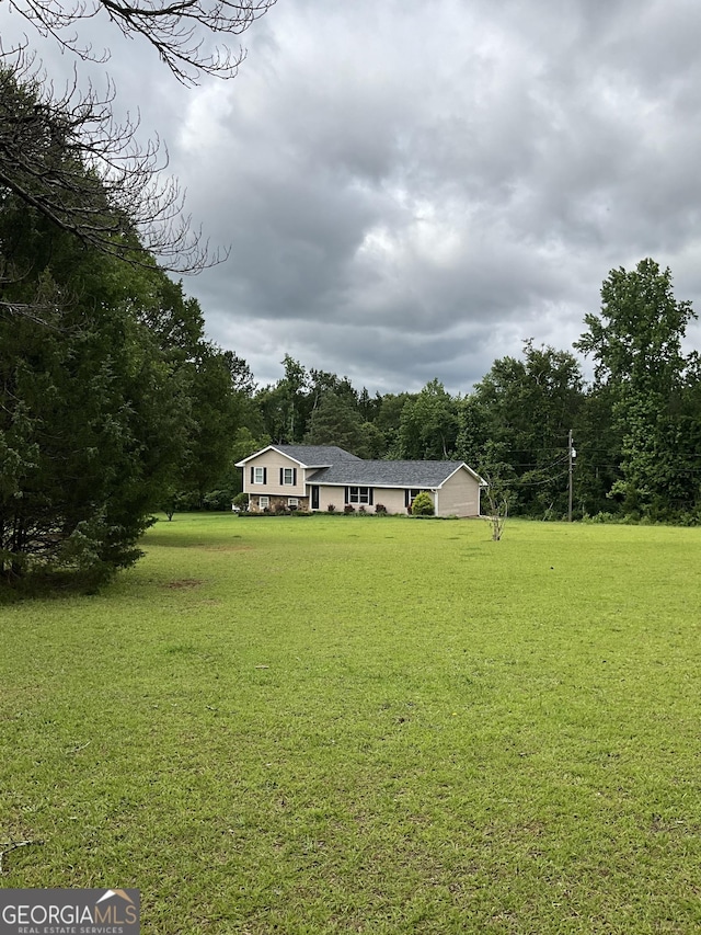 1776 Smokey Rd, Lagrange, GA 30241 - view of green lawn featuring a forest view