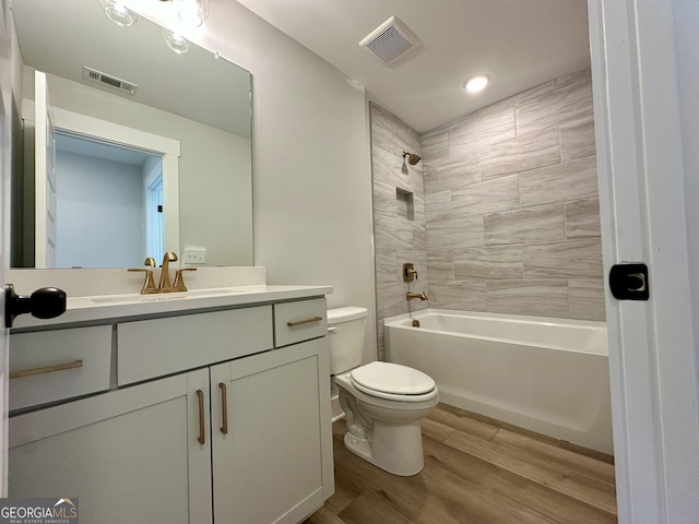 7040 Manchester Dr, Flowery Branch, GA 30542 - bathroom with vanity, wood finished floors, shower / tub combination, and recessed lighting