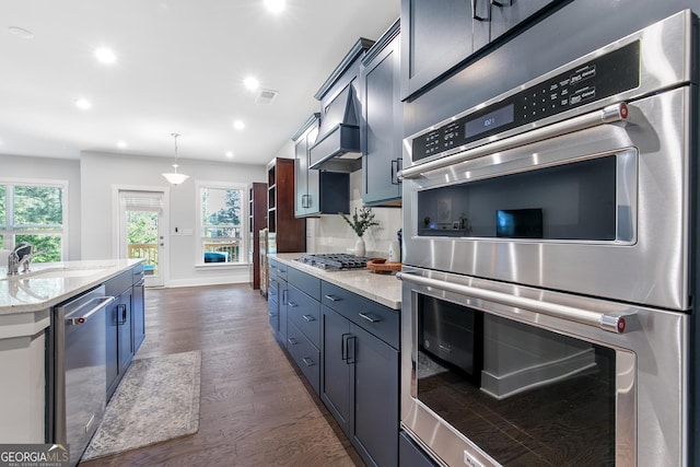 411 Riverclub Rd, Acworth, GA 30101 - kitchen with appliances with stainless steel finishes, a sink, dark wood-style flooring, light stone counters, and recessed lighting
