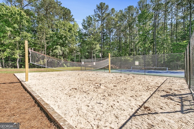 411 Riverclub Rd, Acworth, GA 30101 - surrounding community featuring a tennis court, volleyball court, and view of scattered trees
