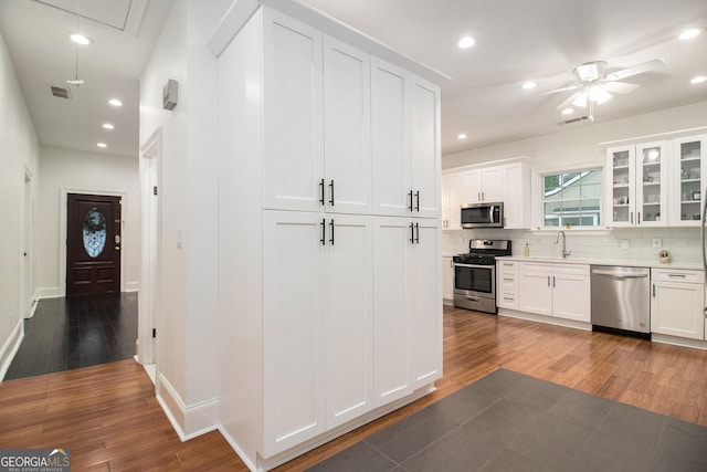 1292 Eubanks Ave, East Point, GA 30344 - kitchen featuring stainless steel appliances, wood finished floors, backsplash, recessed lighting, and ceiling fan