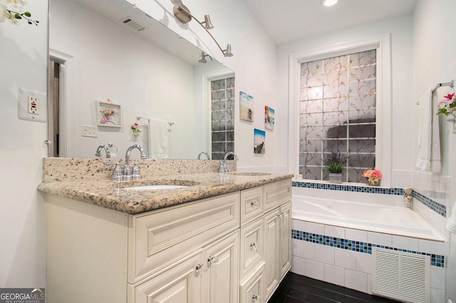 1292 Eubanks Ave, East Point, GA 30344 - bathroom with vanity, a bath, and recessed lighting