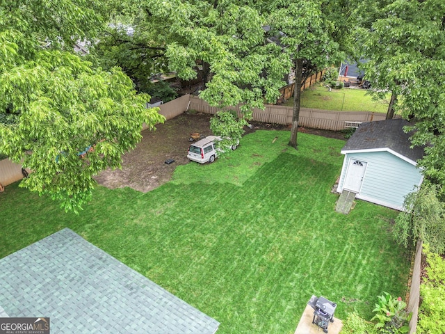 1292 Eubanks Ave, East Point, GA 30344 - fenced backyard featuring an outdoor structure and a patio
