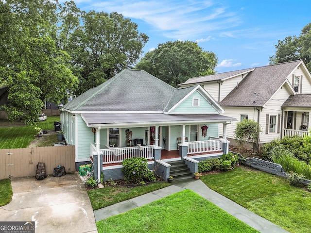 1292 Eubanks Ave, East Point, GA 30344 - bungalow-style home featuring covered porch, roof with shingles, and a gate