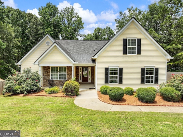 6439 Mossy Boulder Dr, Flowery Branch, GA 30542 - traditional-style home with covered porch