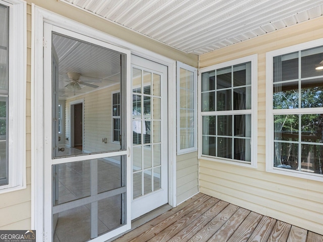 6439 Mossy Boulder Dr, Flowery Branch, GA 30542 - unfurnished sunroom featuring a ceiling fan
