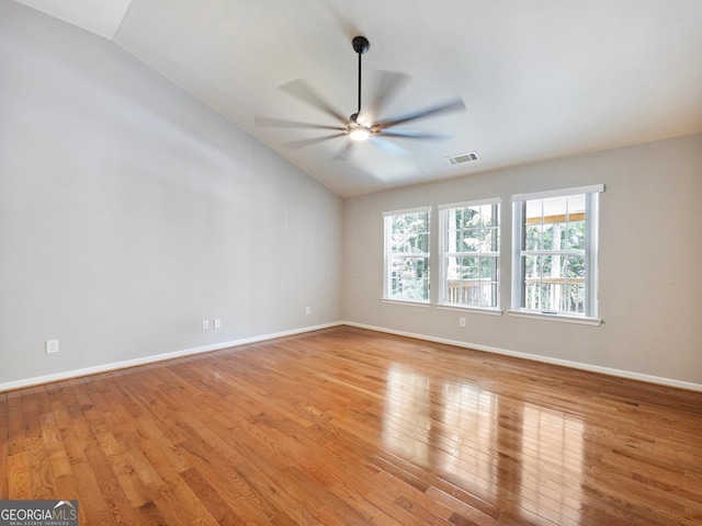 6439 Mossy Boulder Dr, Flowery Branch, GA 30542 - empty room with vaulted ceiling, light wood-type flooring, and a ceiling fan