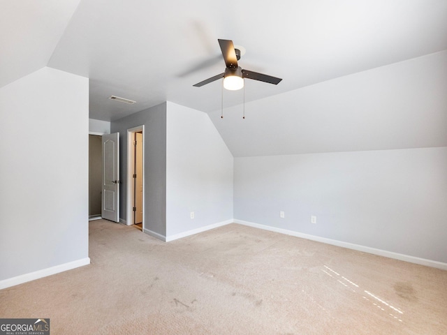 6439 Mossy Boulder Dr, Flowery Branch, GA 30542 - additional living space with lofted ceiling, carpet flooring, and a ceiling fan