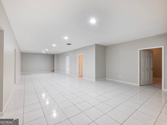6439 Mossy Boulder Dr, Flowery Branch, GA 30542 - unfurnished room with light tile patterned floors and recessed lighting