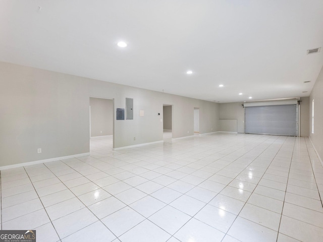 6439 Mossy Boulder Dr, Flowery Branch, GA 30542 - spare room featuring recessed lighting, light tile patterned floors, and electric panel