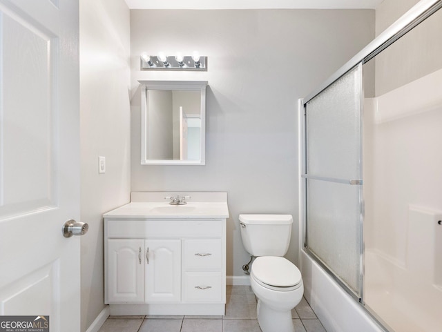 6439 Mossy Boulder Dr, Flowery Branch, GA 30542 - full bath with vanity, tile patterned floors, and combined bath / shower with glass door