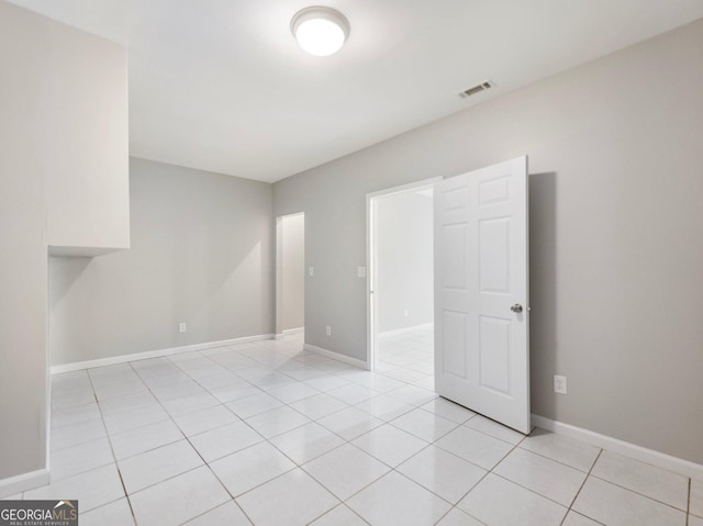 6439 Mossy Boulder Dr, Flowery Branch, GA 30542 - spare room with light tile patterned flooring and baseboards