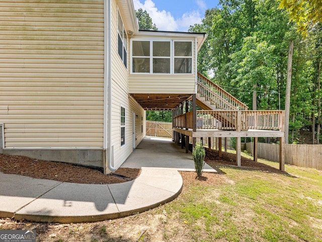 6439 Mossy Boulder Dr, Flowery Branch, GA 30542 - view of side of property with stairway and a sunroom