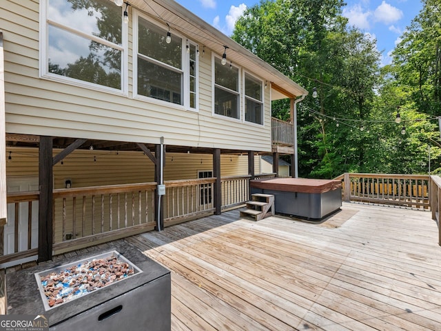 6439 Mossy Boulder Dr, Flowery Branch, GA 30542 - wooden terrace featuring a hot tub and an outdoor fire pit