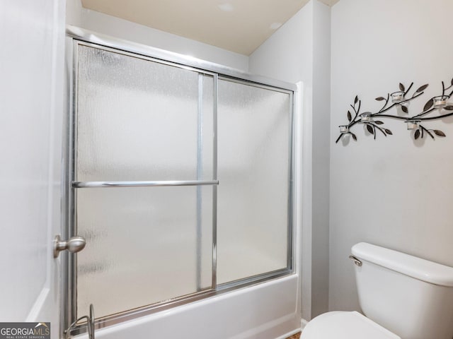 6439 Mossy Boulder Dr, Flowery Branch, GA 30542 - full bathroom with toilet and bath / shower combo with glass door