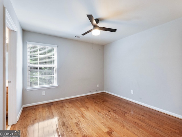 6439 Mossy Boulder Dr, Flowery Branch, GA 30542 - empty room with light wood-type flooring and ceiling fan