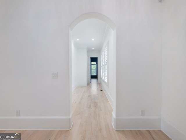 5832 Lula Bridge Ln, Braselton, GA 30517 - hallway with arched walkways, crown molding, light wood finished floors, and recessed lighting